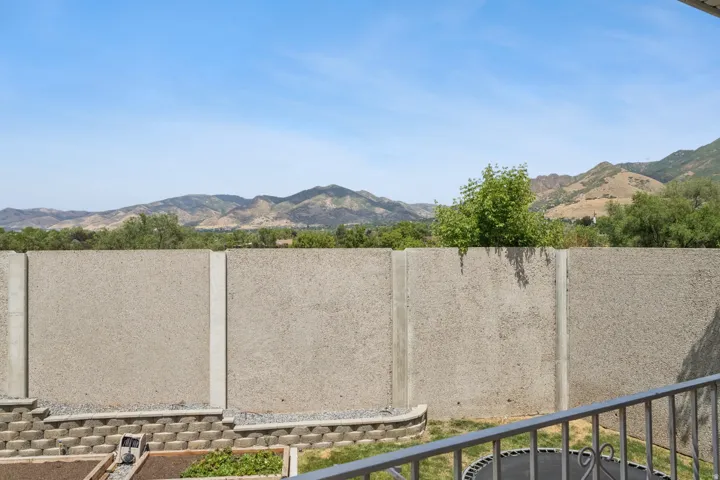 Concrete perimeter wall with mountain backdrop