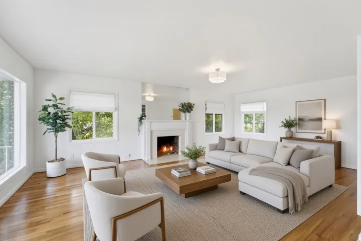 Hardwood flooring, fireplace with mantel, recessed lighting, multiple windows, and a flush mount ceiling fixture