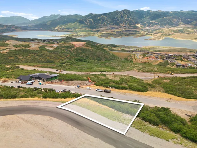 Expansive land parcel featuring natural vegetation and surrounding mountains