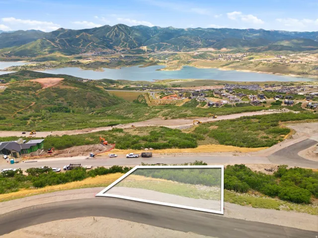 Elevated lot with established roadway and surrounding natural landscape