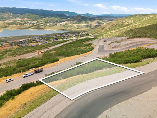 Mountainous terrain, surrounding water body, and established residential areas