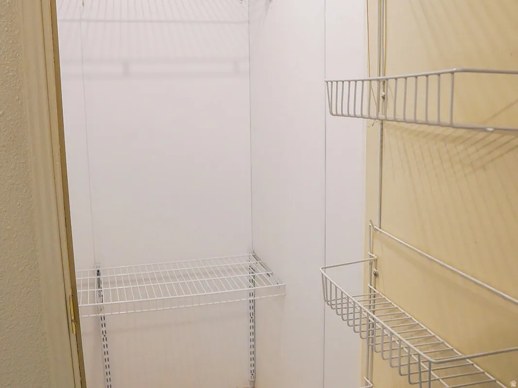 Wire shelving system, tiled flooring, wire rack door storage