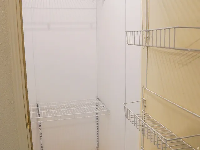 Wire shelving system, tiled flooring, wire rack door storage
