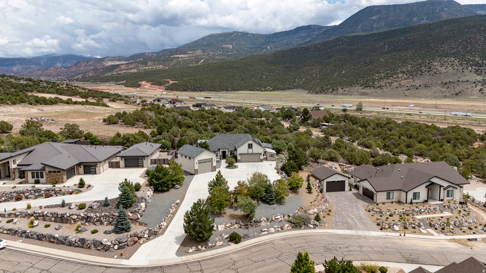 Sprawling residential compound showcasing multiple residences nestled within mature landscaping and native vegetation