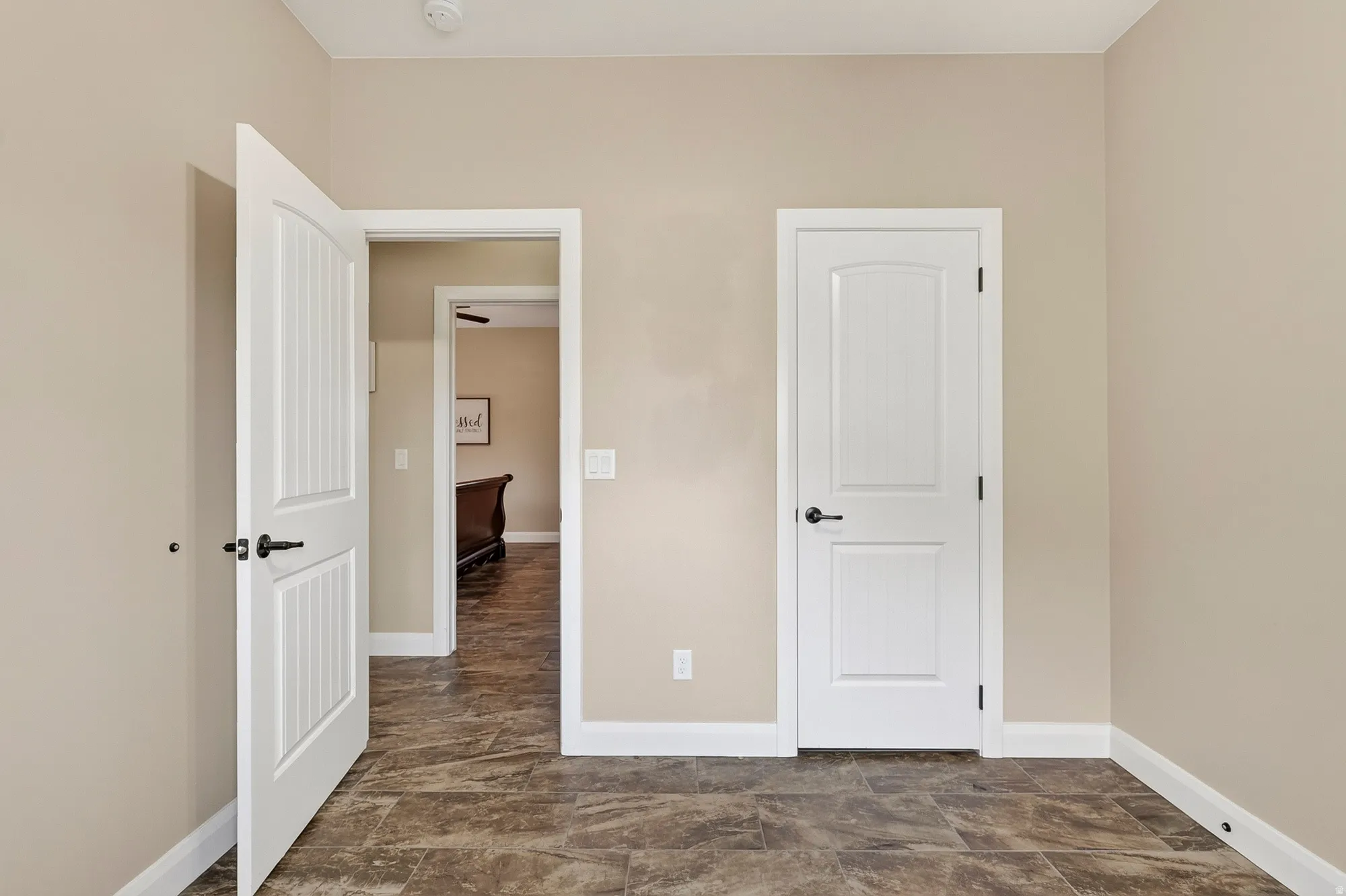 Neutral-toned walls complement the patterned tile flooring
