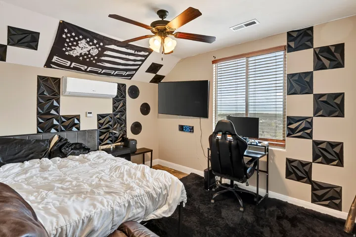 Wood-finish ceiling fan with integrated lighting, window with horizontal blinds, wall-mounted display, and built-in mini-split unit