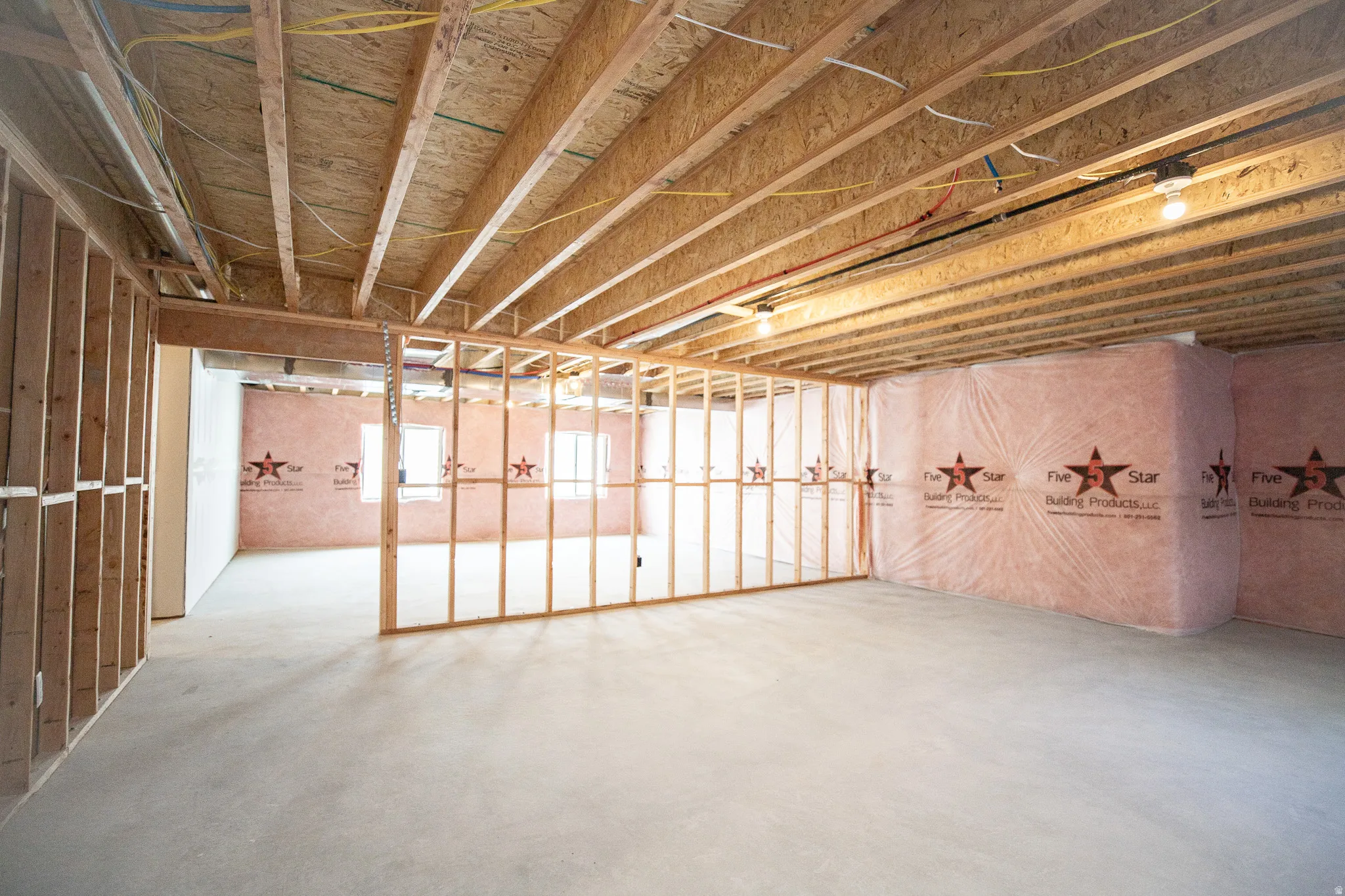 Unfinished basement with potential for two bedrooms and large family/game room.