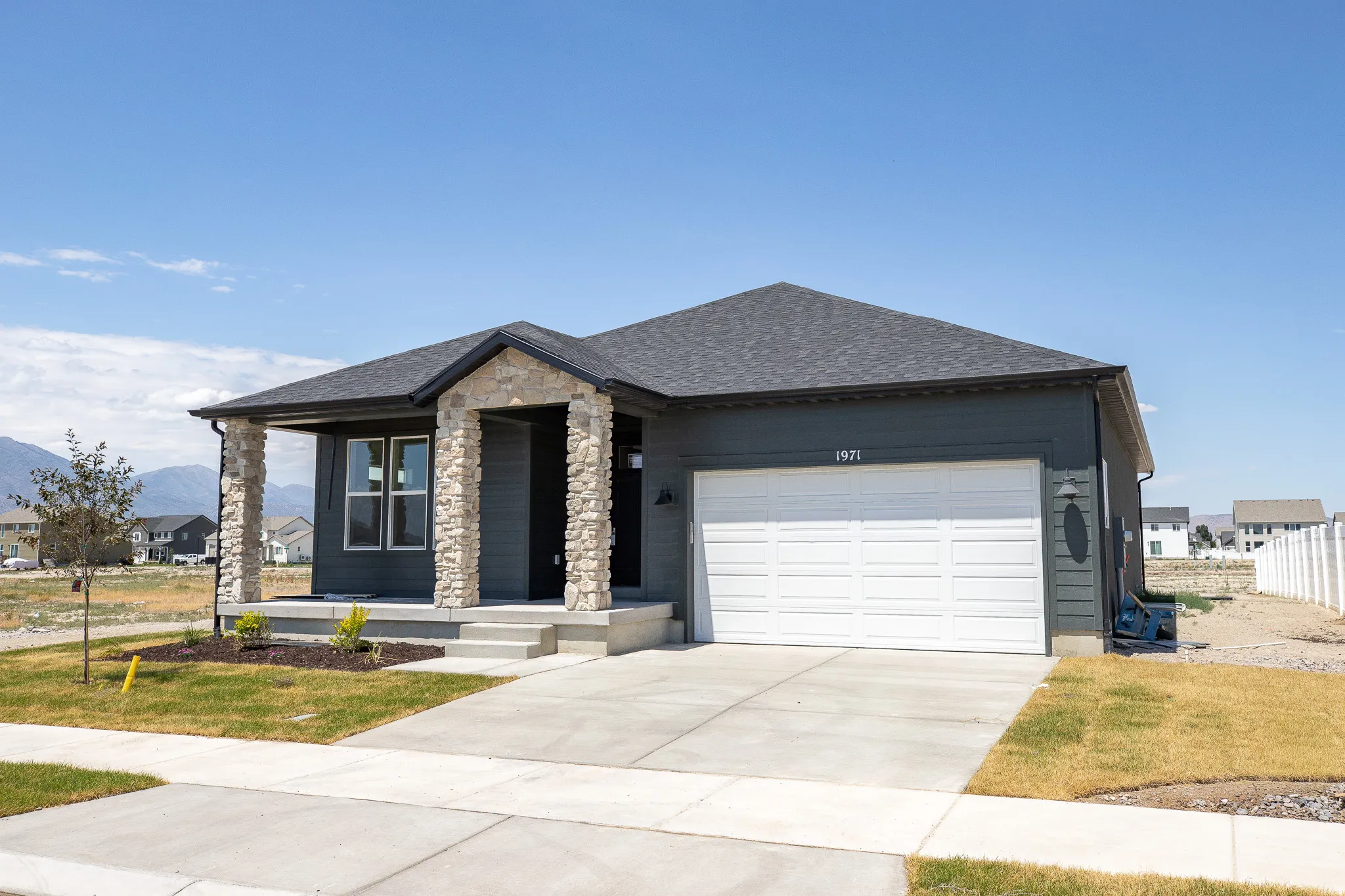 Granite Elevation A with extended porch and open space to rear and city park to the left to be installed.