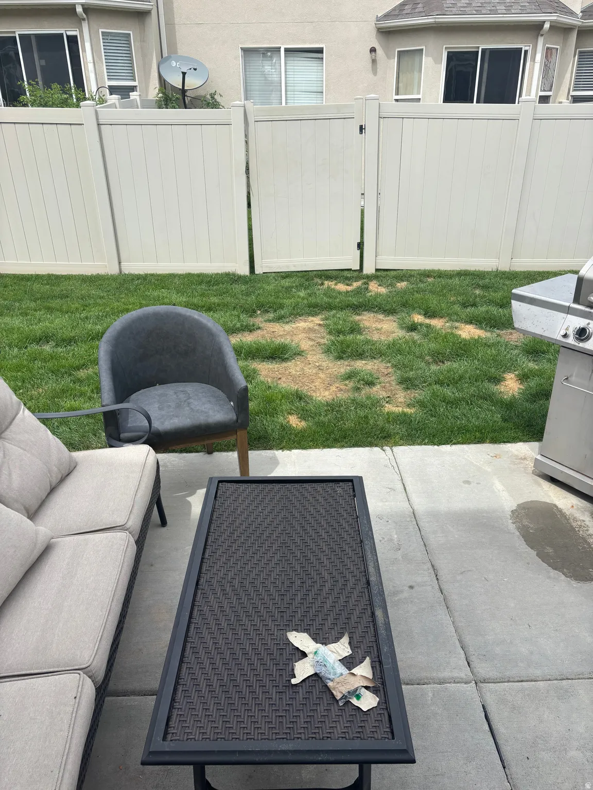 Private backyard patio featuring concrete pavers