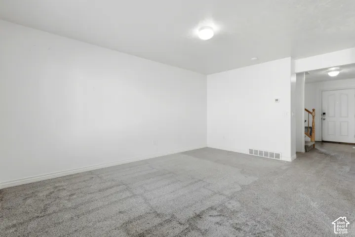 Neutral-toned carpeting throughout