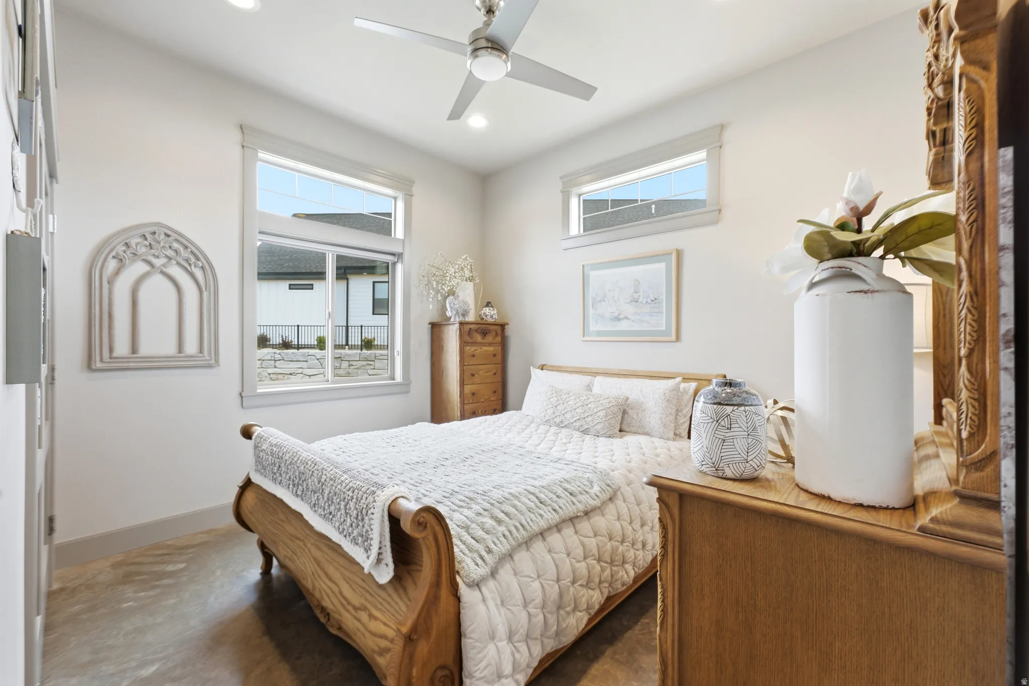 High ceilings featuring recessed lighting, a modern ceiling fan, and large windows with transom accents