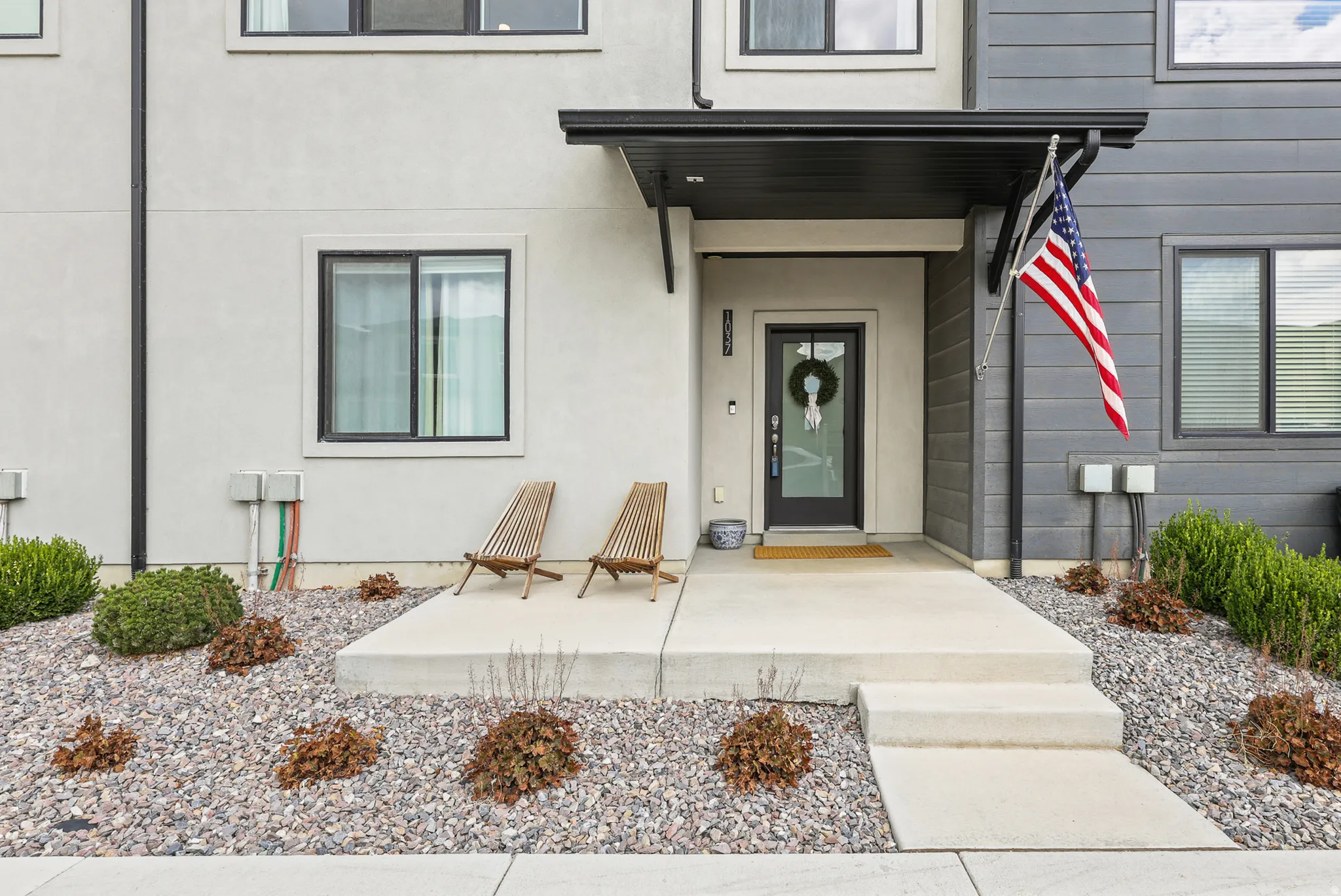 Modern façade featuring both stucco and horizontal siding