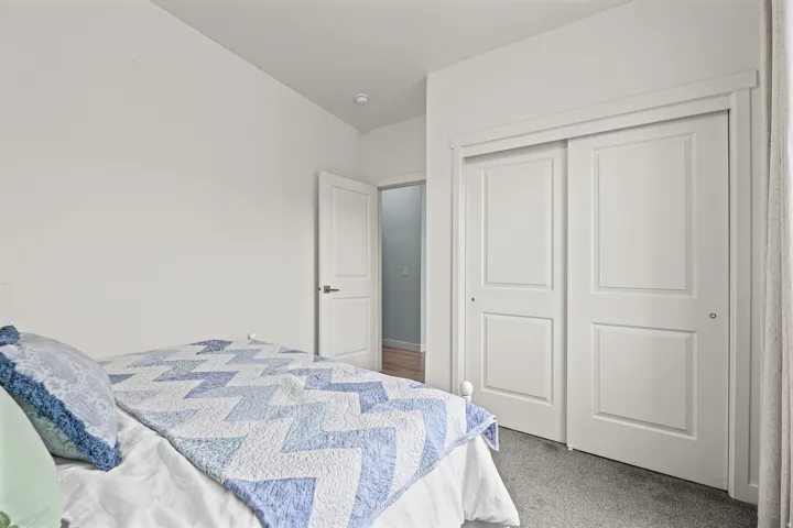 Recessed lighting and a white paneled door