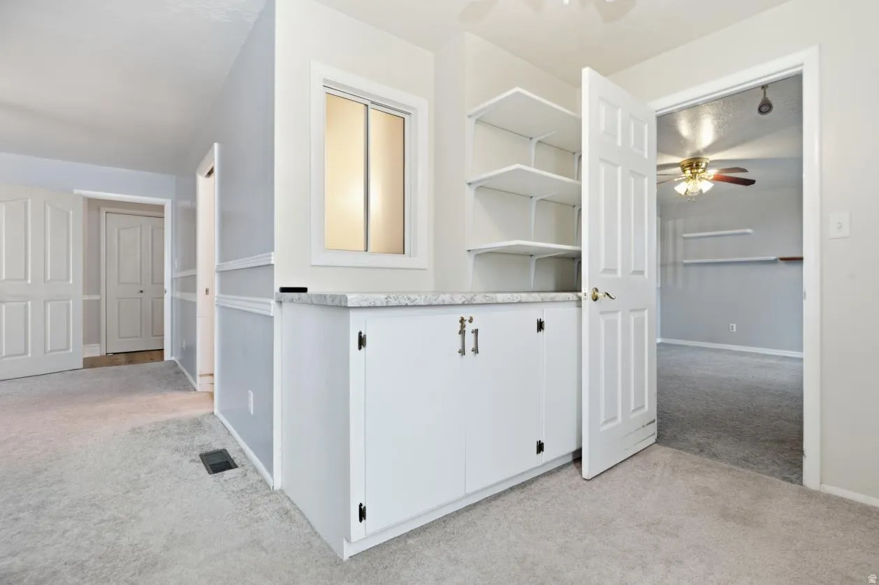 Bedroom with a large walk around closet/storage area