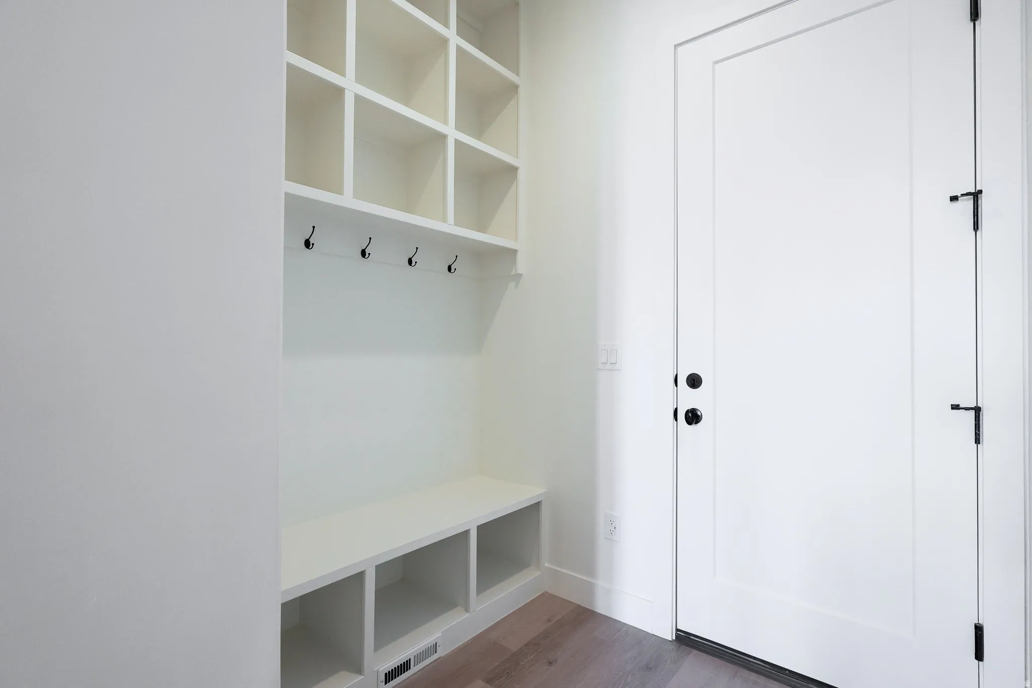 White paneled door with matte black hardware