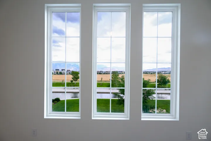 Three large windows overlooking watercourse