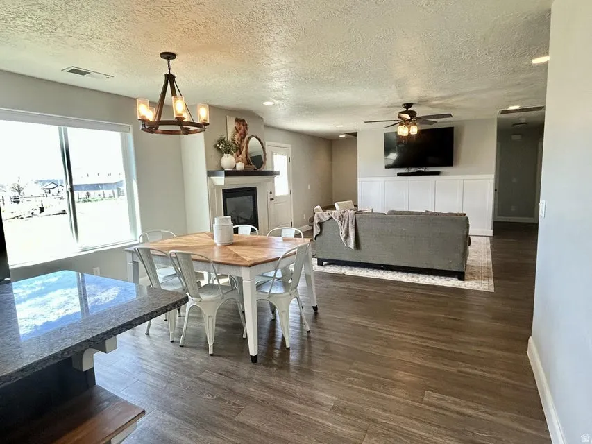 Wood-finish flooring throughout the open-concept living and dining areas