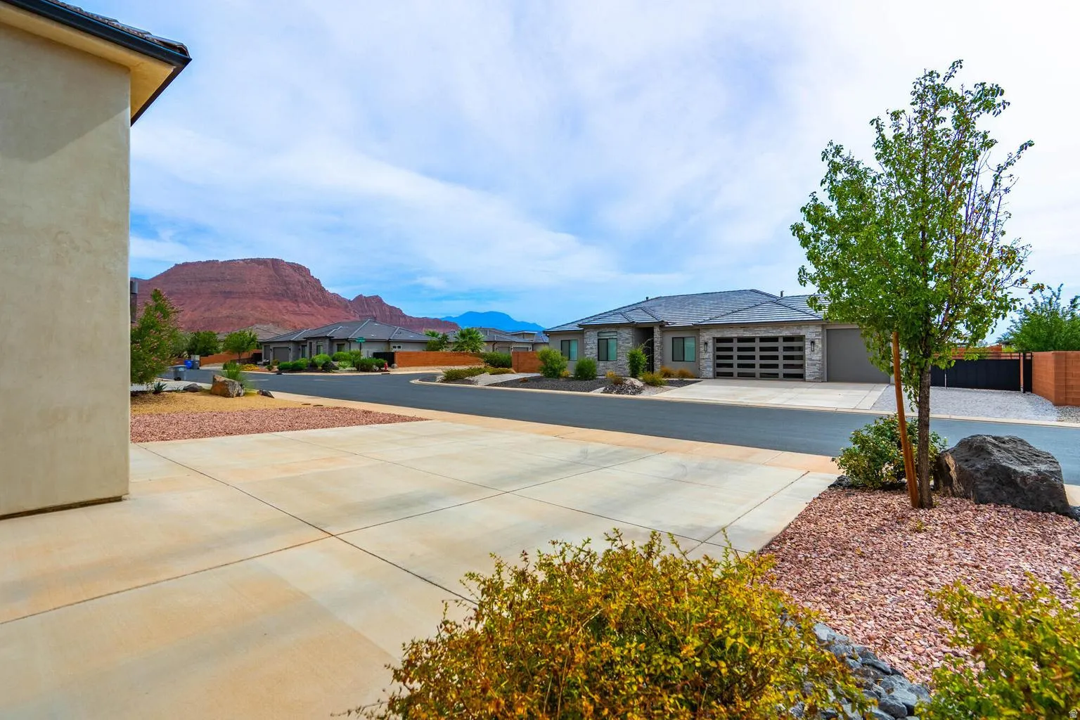 Concrete driveway with a stone-accented perimeter