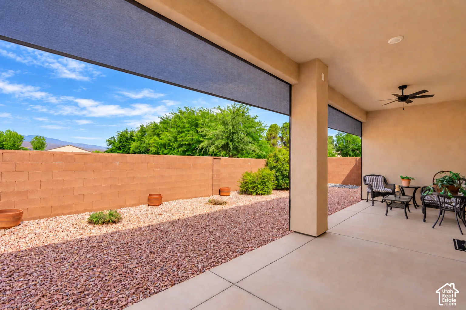Covered patio with a ceiling fan, recessed lighting, and retractable screens