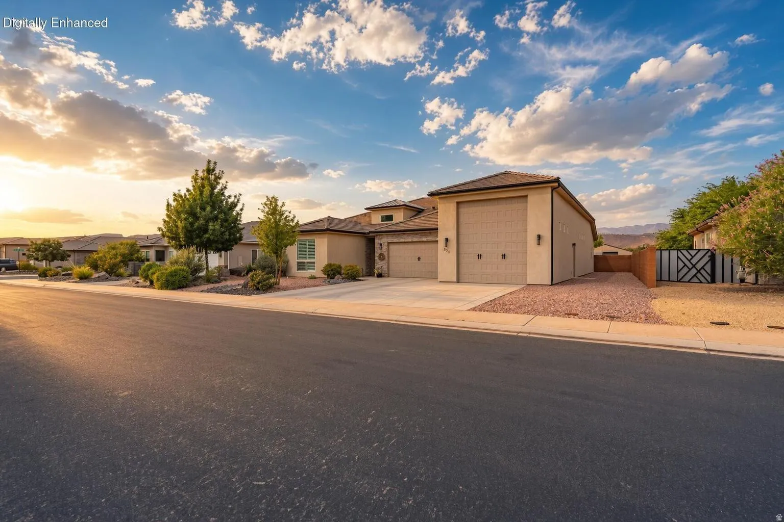 Stucco exterior with a tile roof and multiple garage doors