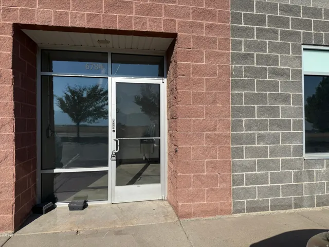 Entryway featuring a full-light glass door, aluminum door frame, and transom window