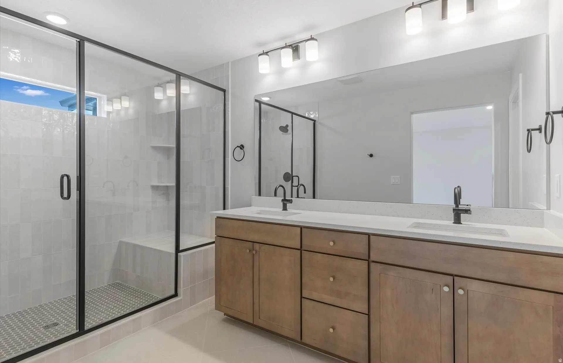 Walk-in shower with tiled walls and built-in bench