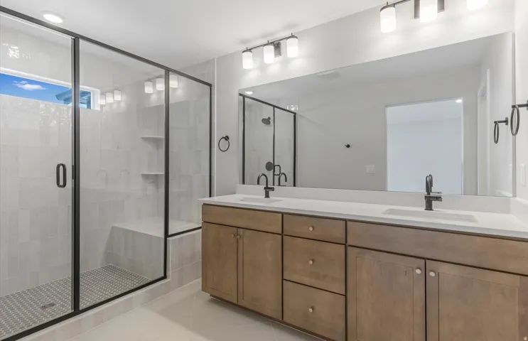 Walk-in shower with tiled walls and built-in bench