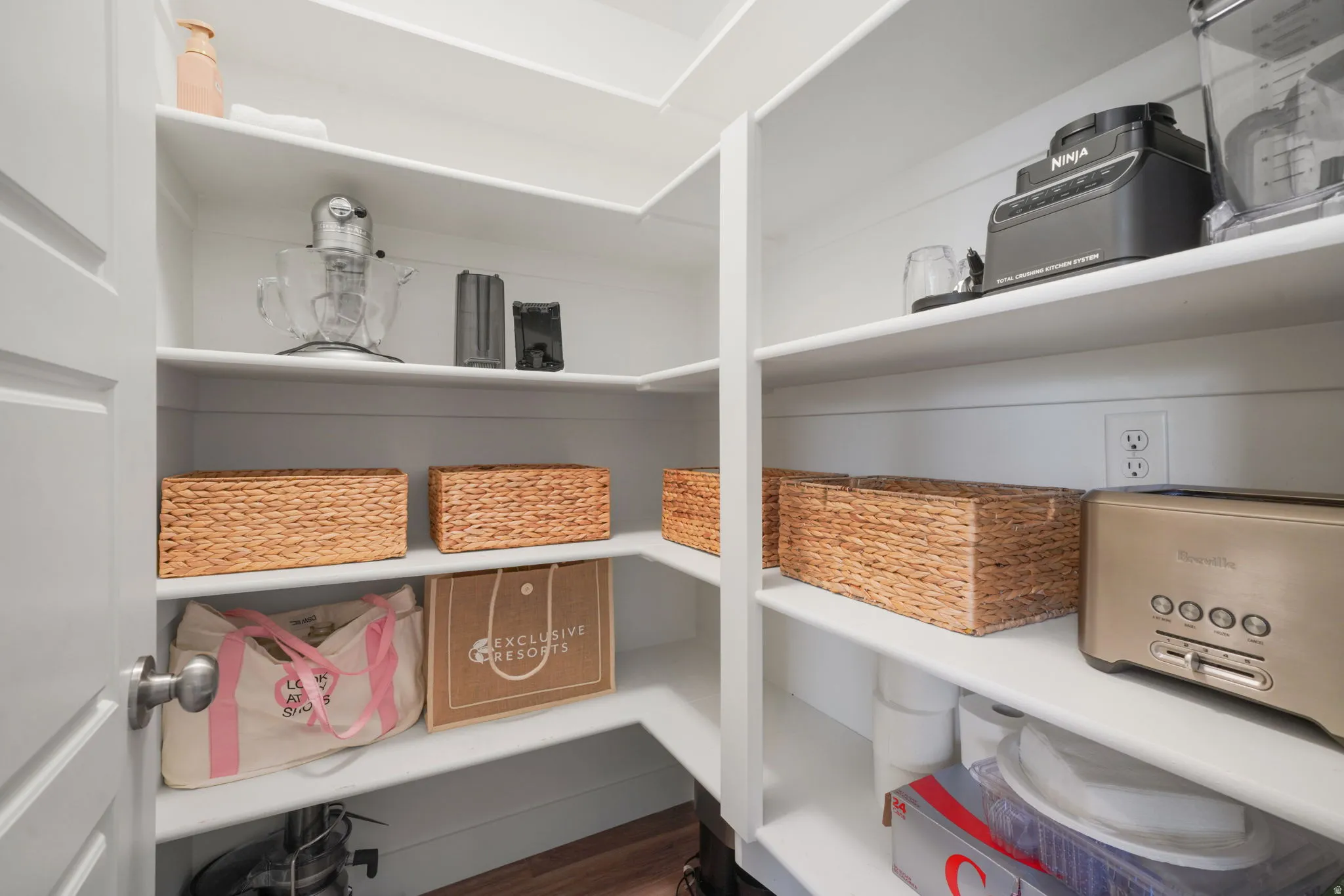 White built-in shelving with multiple outlets