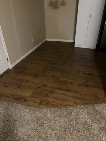 Wood-finish flooring with baseboard trim