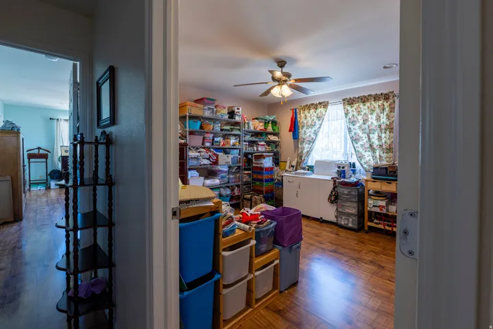 Wood-finish flooring with ceiling fan