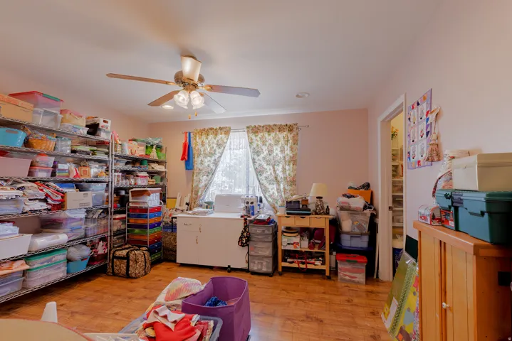 Wood-finish flooring with a ceiling fan with integrated lighting