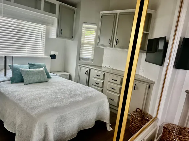 Built-in cabinetry and drawers, integrated window blinds, wood-finish flooring