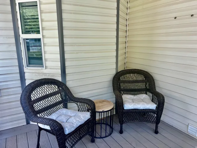 Exterior siding, corner window, and grey-toned decking