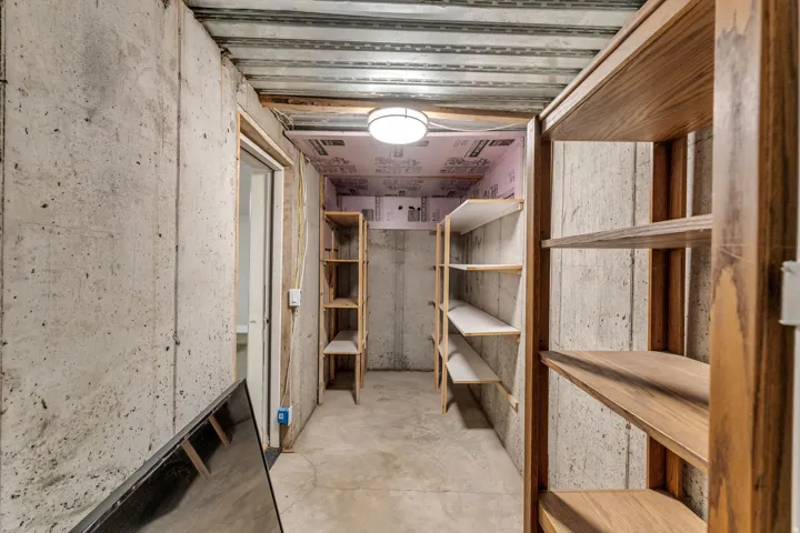 Concrete walls with exposed ceiling joists