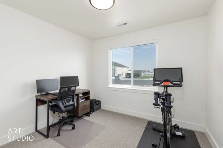 Recessed ceiling light, large window, carpet flooring, white walls, white trim