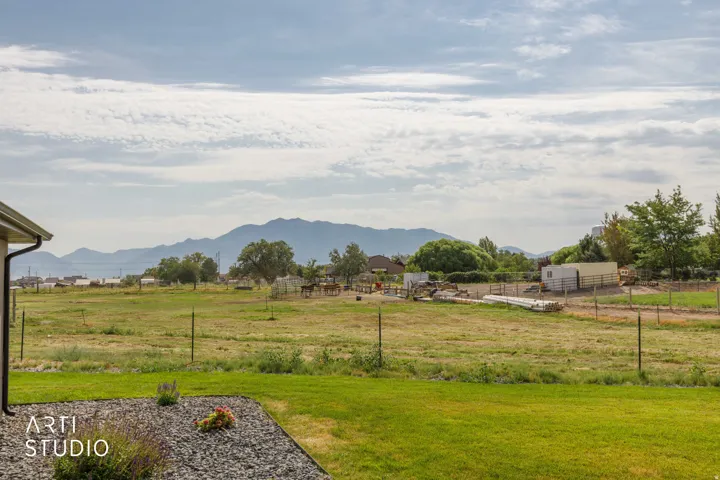 Expansive green lawn with mountain backdrop