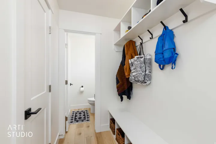 Built-in hall tree with integrated bench seating, cubbies, and coat hooks