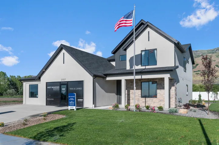 Modern two-story exterior with stucco siding and dark trim