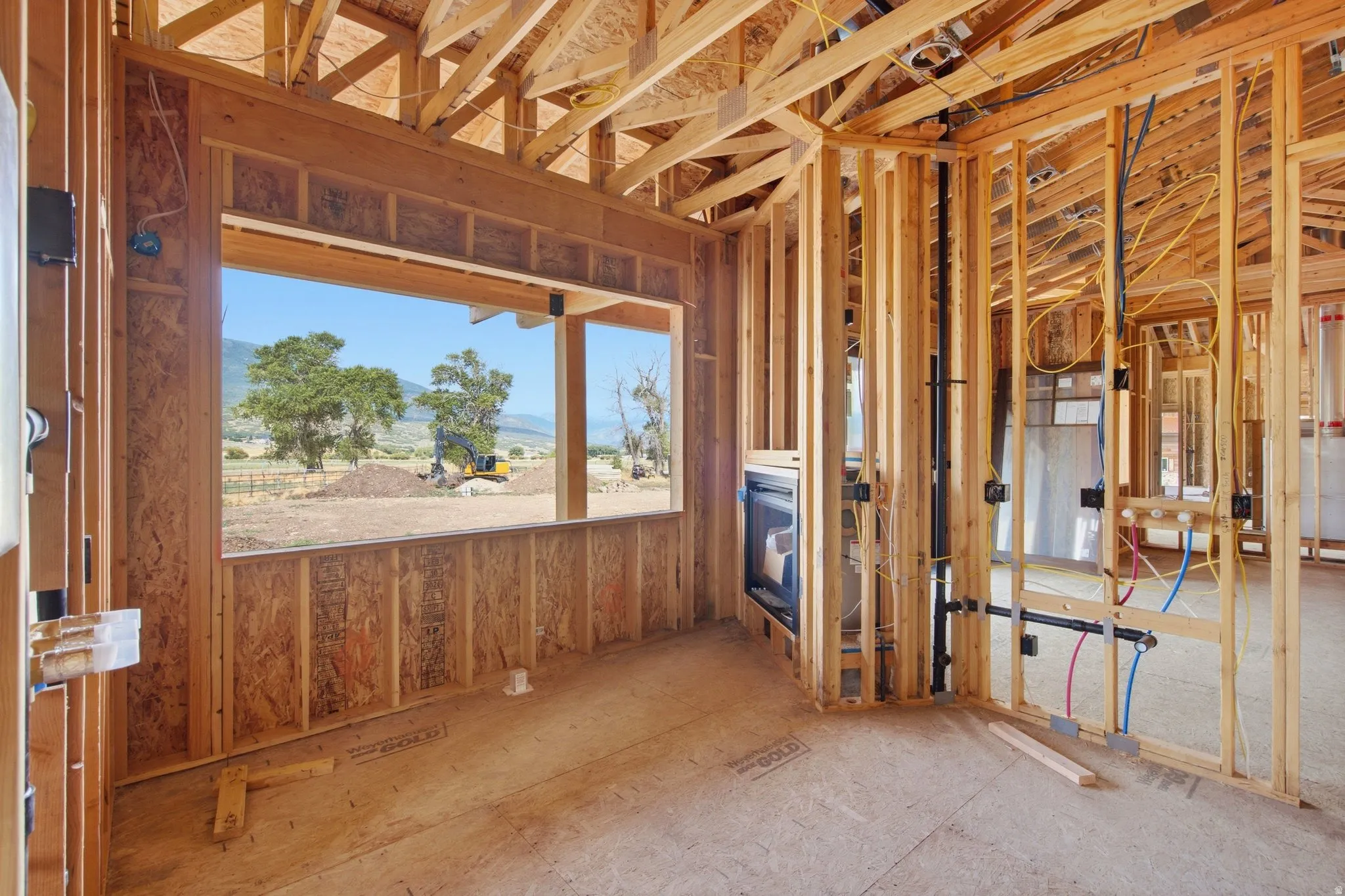 Primary bedroom bathroom with a gas fireplace & amazing views