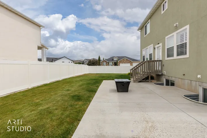 Expansive concrete patio with direct outdoor access