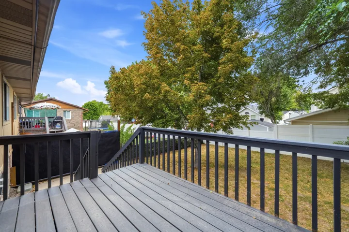 Composite deck with dark railings and steps