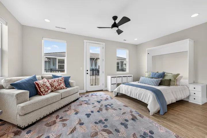 Recessed lighting, wood-finish flooring, ceiling fan, and a built-in wall bed