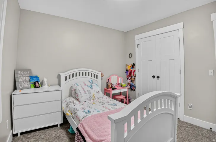 Light gray wall paint, white trim, and a built-in closet with white doors
