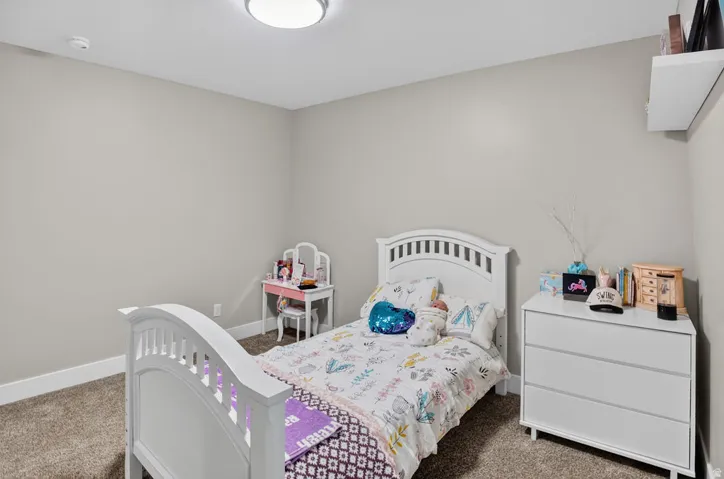 Neutral wall paint, recessed lighting, and carpeted flooring