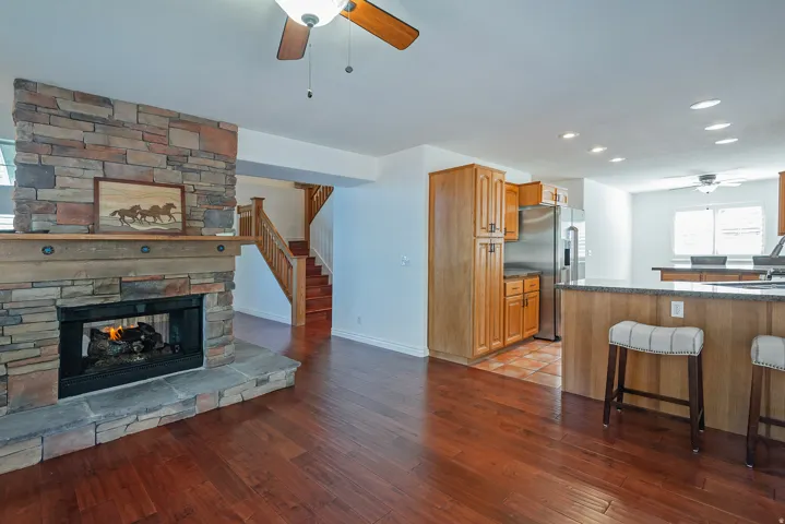 Dining Area & Two-Sided Fireplace to the Kitchen