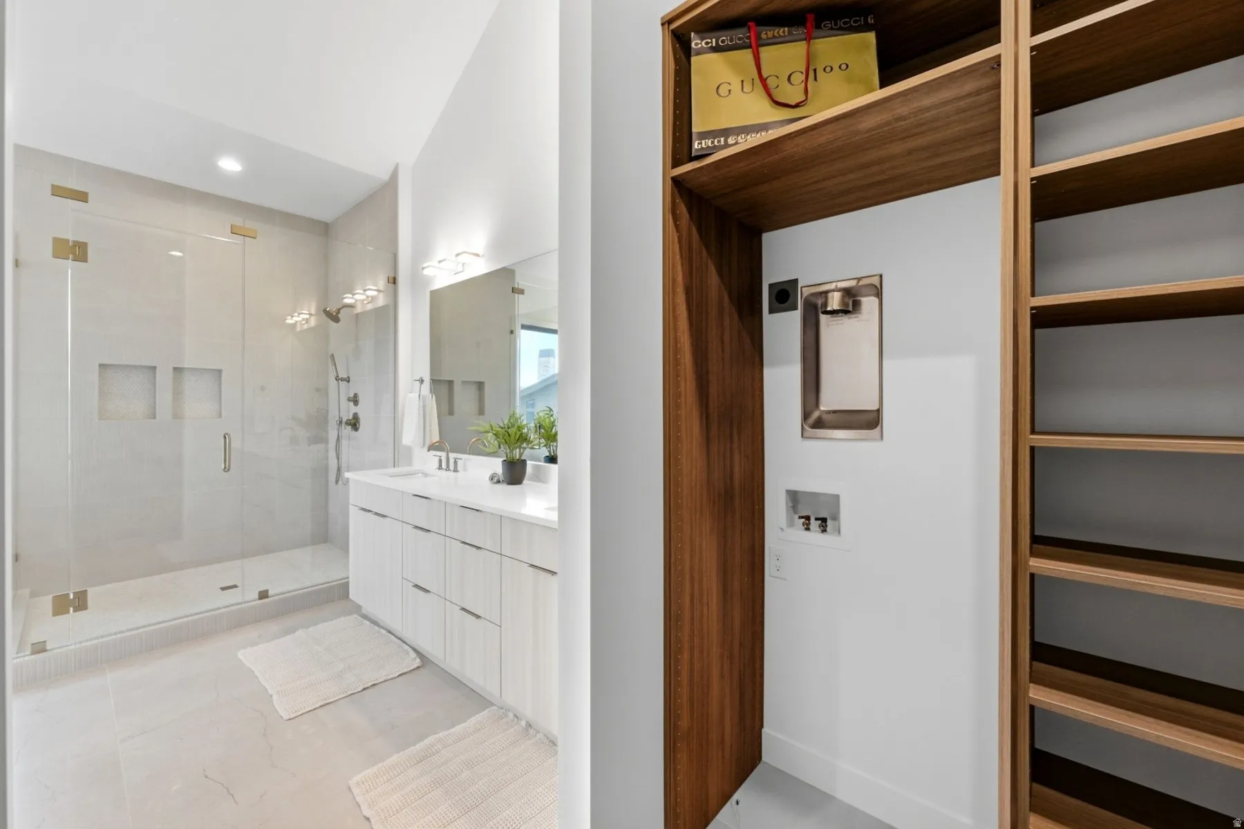 Dual vanity with white cabinetry and integrated sinks