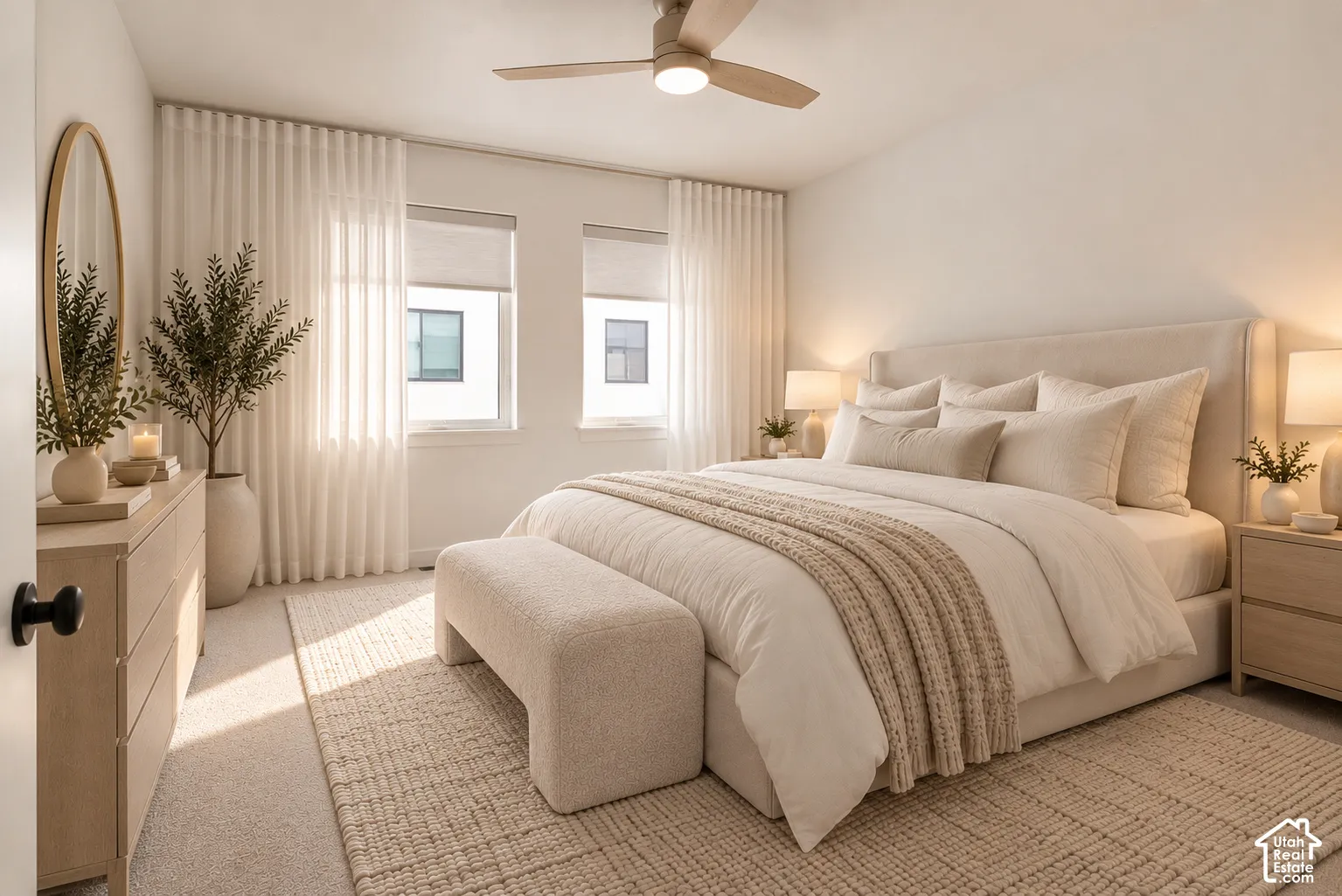 Neutral-toned bedroom featuring dual windows, wall-to-wall carpeting, and a ceiling-mounted light fixture with fan blades