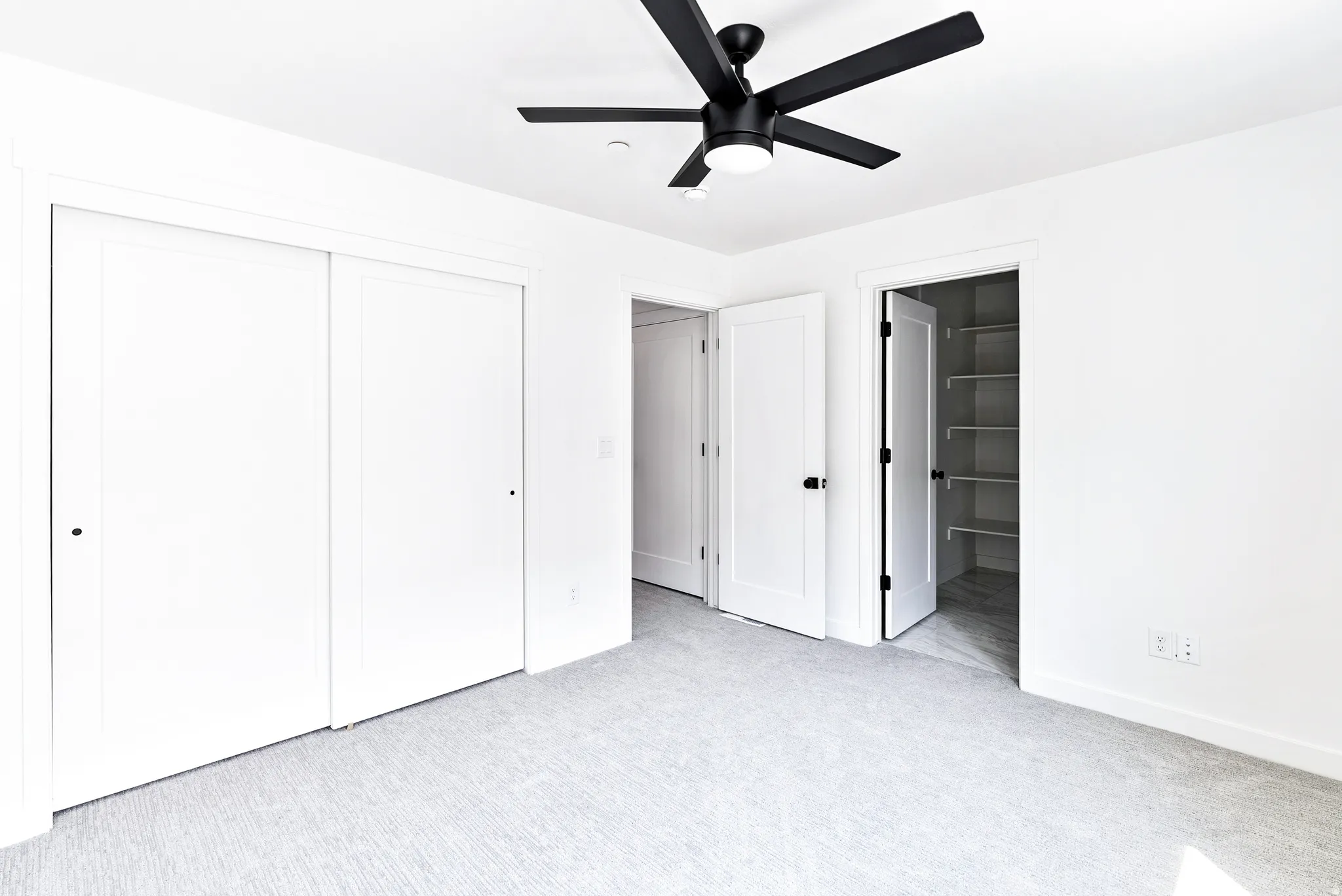 White walls with light gray carpeting