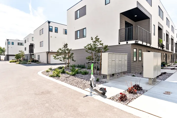 Modern architectural design featuring clean lines and a white and dark gray exterior