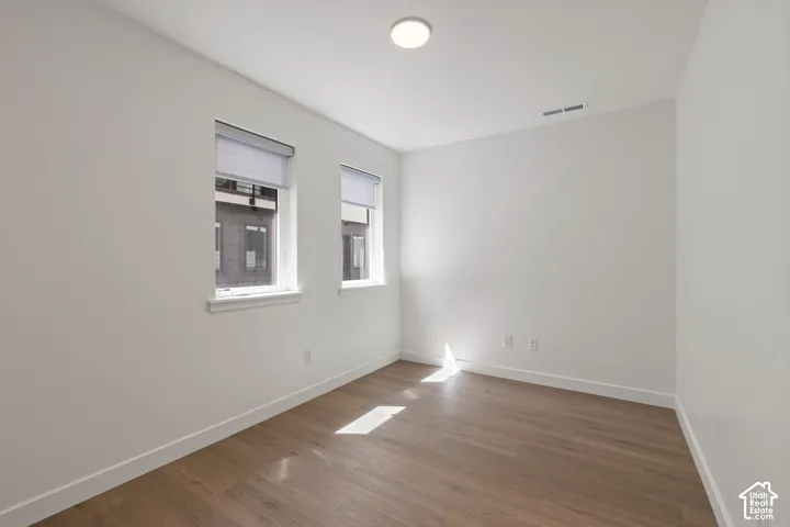 White walls with wood-finish flooring